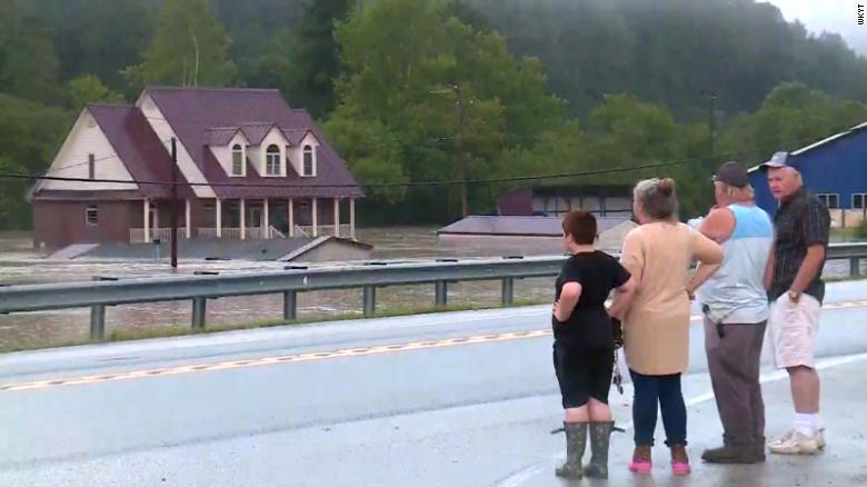 Floodwater surrounds buildings in the community of Lost Creek in eastern Kentucky's Breathitt County
